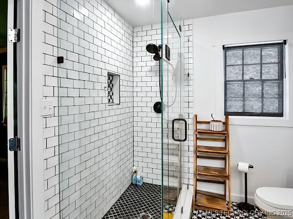 801 S Rennie St, Ada, OK 74820 - bathroom featuring a stall shower and toilet