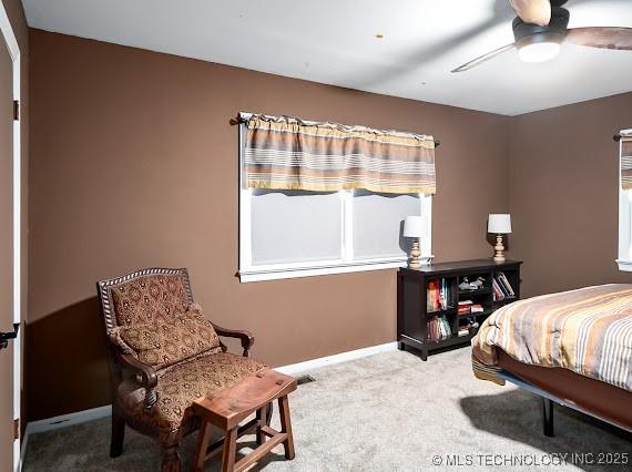 801 S Rennie St, Ada, OK 74820 - carpeted bedroom with baseboards and a ceiling fan