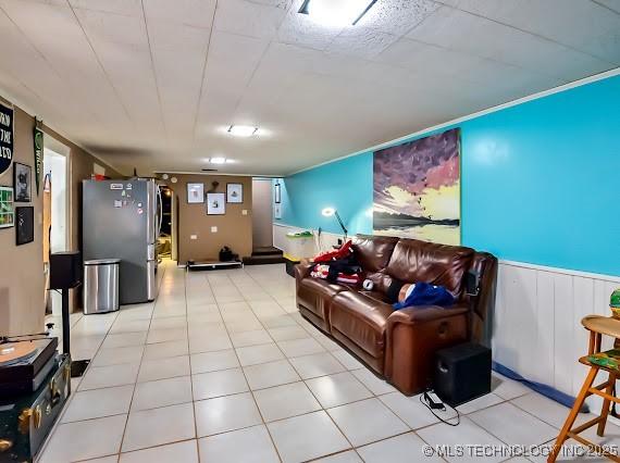 801 S Rennie St, Ada, OK 74820 - living room with a wainscoted wall