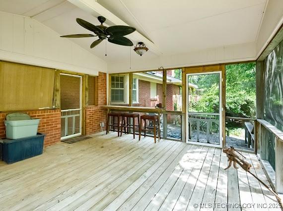 801 S Rennie St, Ada, OK 74820 - sunroom with ceiling fan and exterior bar