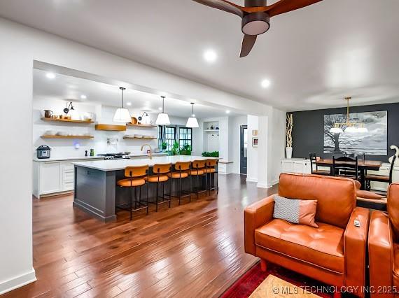 801 S Rennie St, Ada, OK 74820 - living area with dark wood-style floors, a ceiling fan, and recessed lighting