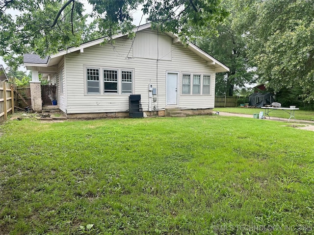 1327 E 10th St, Okmulgee, OK 74447 - rear view of house with entry steps