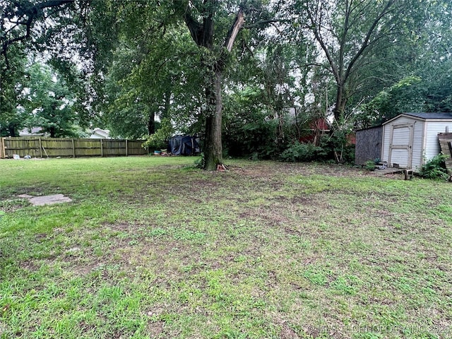 1327 E 10th St, Okmulgee, OK 74447 - view of yard featuring a shed