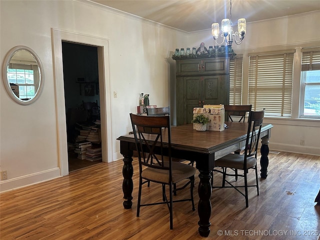 1327 E 10th St, Okmulgee, OK 74447 - dining area featuring a chandelier, crown molding, and wood finished floors