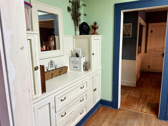 1327 E 10th St, Okmulgee, OK 74447 - detailed view of wood finished floors and a decorative wall