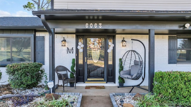 6063 Wilson, Durant, OK 74701 - entrance to property with a porch and brick siding