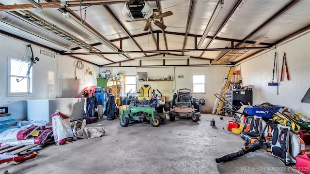 6063 Wilson, Durant, OK 74701 - garage with a garage door opener and ceiling fan