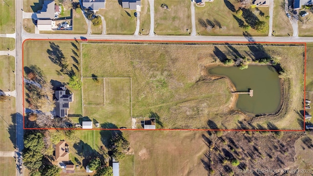 6063 Wilson, Durant, OK 74701 - aerial perspective of suburban area featuring property boundaries highlighted and a large body of water