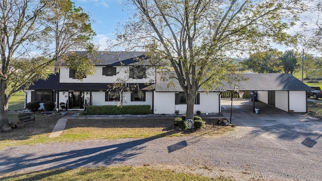 6063 Wilson, Durant, OK 74701 - view of front of house with dirt driveway and a carport