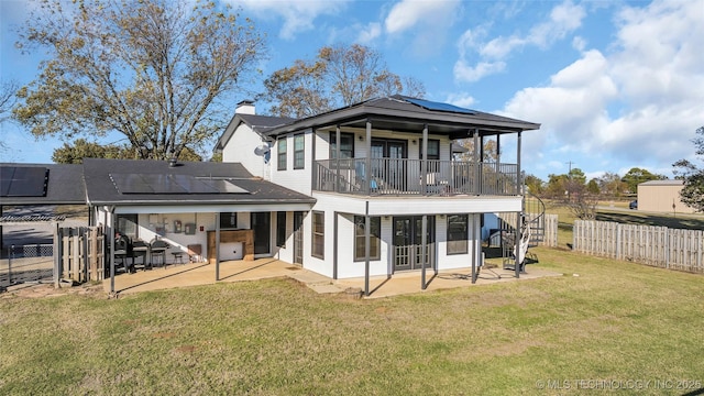 6063 Wilson, Durant, OK 74701 - rear view of house featuring a patio, solar panels, and french doors