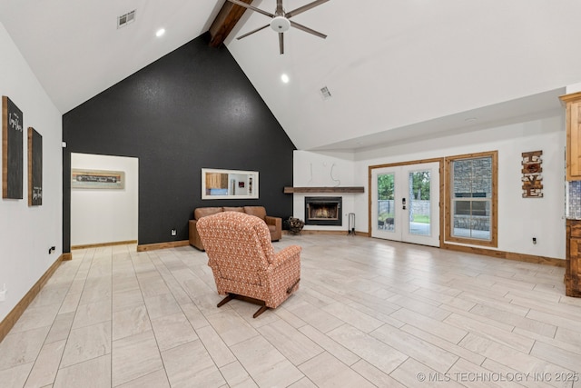 15303 Foreacre Cir, Sapulpa, OK 74066 - living area with high vaulted ceiling, a ceiling fan, a lit fireplace, beamed ceiling, and baseboards