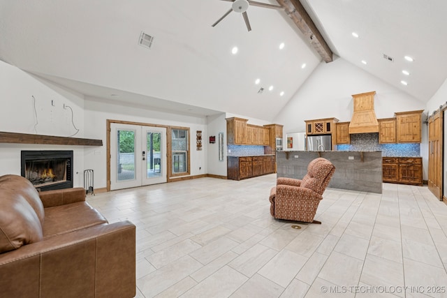 15303 Foreacre Cir, Sapulpa, OK 74066 - living room with beam ceiling, high vaulted ceiling, ceiling fan, a warm lit fireplace, and recessed lighting