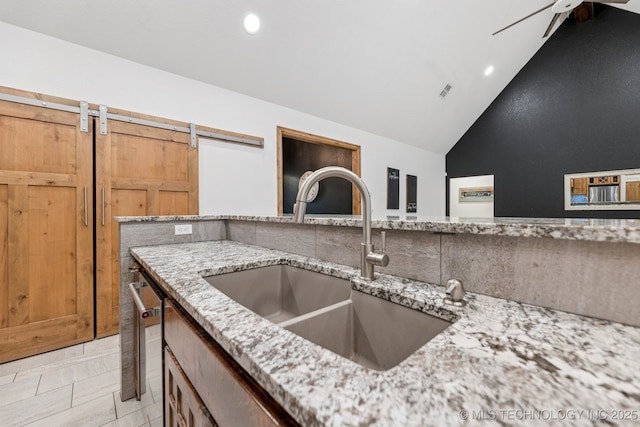 15303 Foreacre Cir, Sapulpa, OK 74066 - kitchen view of a sink, light stone countertops, and recessed lighting