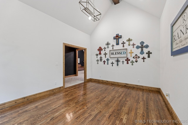 15303 Foreacre Cir, Sapulpa, OK 74066 - empty room with wood finished floors, high vaulted ceiling, and baseboards