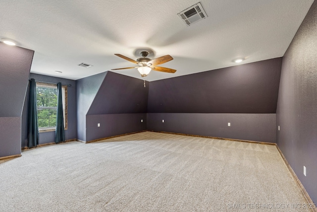15303 Foreacre Cir, Sapulpa, OK 74066 - bonus room with carpet, a ceiling fan, lofted ceiling, a textured ceiling, and baseboards