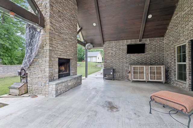 15303 Foreacre Cir, Sapulpa, OK 74066 - view of patio with an outdoor stone fireplace