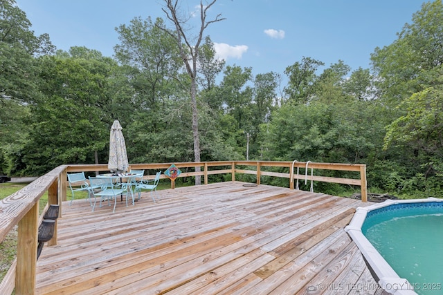 15303 Foreacre Cir, Sapulpa, OK 74066 - wooden terrace with outdoor dining area and an outdoor pool