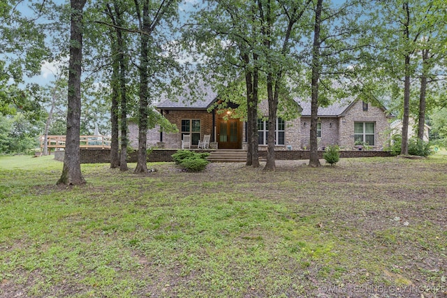 15303 Foreacre Cir, Sapulpa, OK 74066 - view of front of home featuring a porch, brick siding, and a front yard