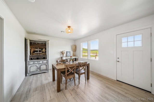 11860 N 68th W Ave, Sperry, OK 74073 - dining room with plenty of natural light, light wood finished floors, baseboards, and crown molding