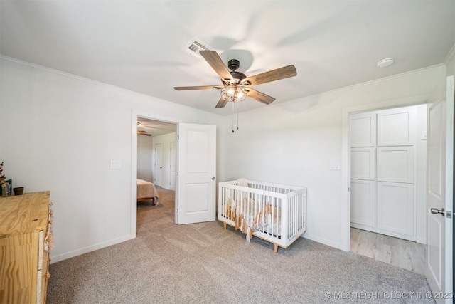 11860 N 68th W Ave, Sperry, OK 74073 - bedroom with light colored carpet, ornamental molding, baseboards, and ceiling fan