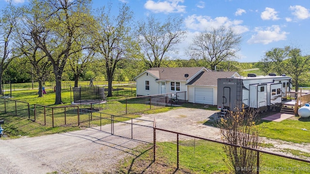 11860 N 68th W Ave, Sperry, OK 74073 - view of front of home featuring driveway, a gate, a garage, and view of scattered trees