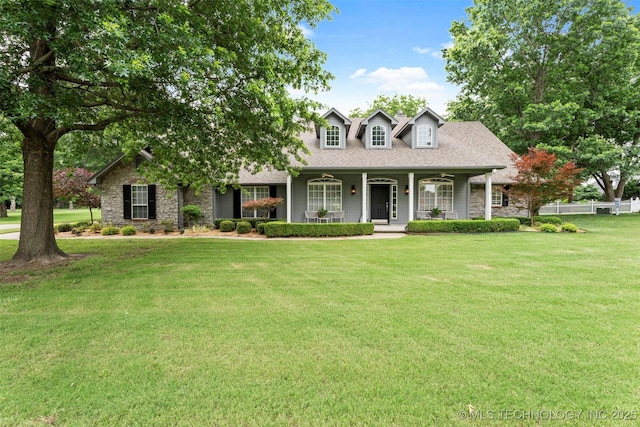 5070 Lake Breeze Rd, Grove, OK 74344 - cape cod home featuring a porch, stone siding, and a shingled roof