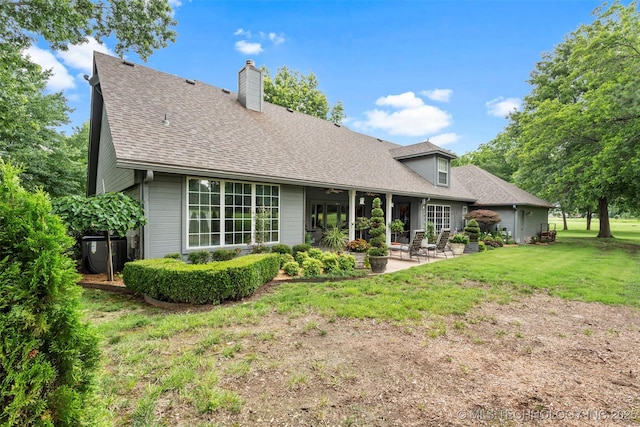 5070 Lake Breeze Rd, Grove, OK 74344 - rear view of property featuring a patio, a yard, a chimney, and roof with shingles