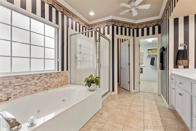 5070 Lake Breeze Rd, Grove, OK 74344 - bathroom featuring a stall shower, a jetted tub, vanity, ornamental molding, and a ceiling fan