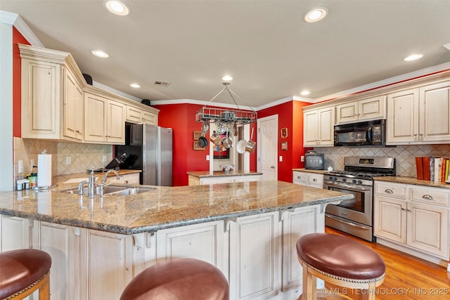 5070 Lake Breeze Rd, Grove, OK 74344 - kitchen featuring appliances with stainless steel finishes, a breakfast bar area, crown molding, decorative backsplash, and a peninsula