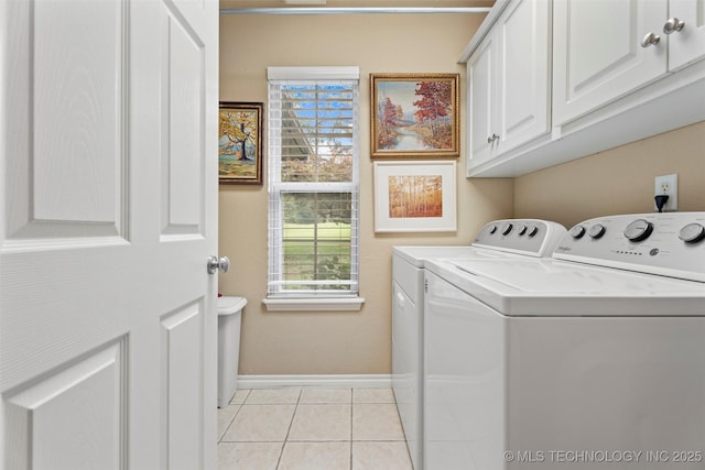 5070 Lake Breeze Rd, Grove, OK 74344 - laundry area with washing machine and clothes dryer, cabinet space, plenty of natural light, and light tile patterned floors