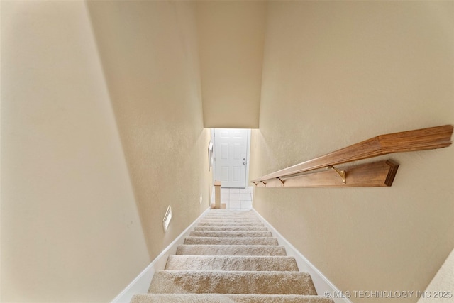 5070 Lake Breeze Rd, Grove, OK 74344 - staircase with a textured wall and carpet flooring