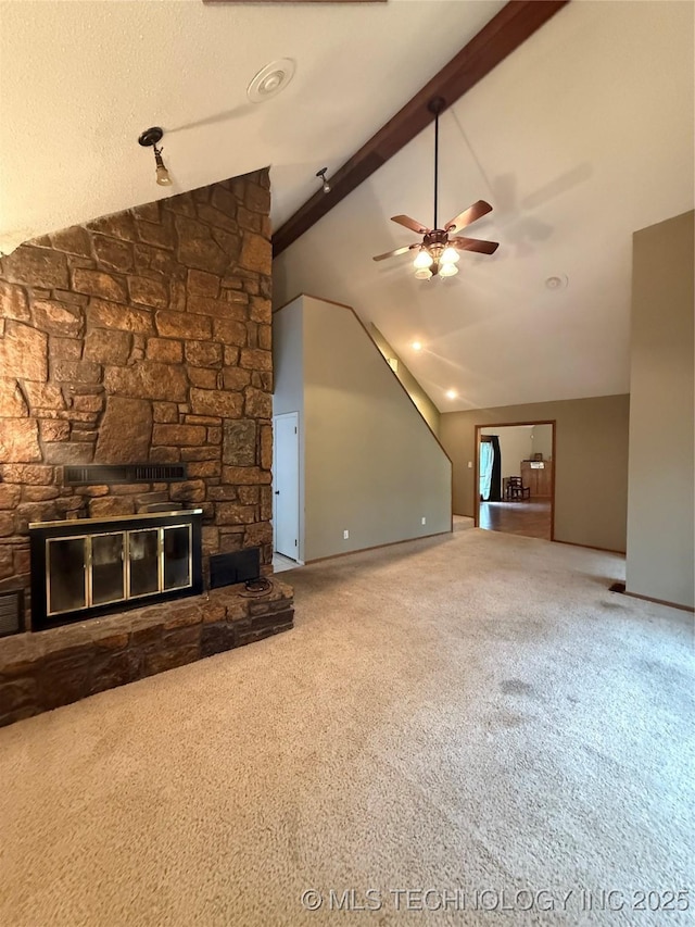 1808 N Woodland, Drumright, OK 74030 - unfurnished living room with ceiling fan, carpet, a stone fireplace, and baseboards