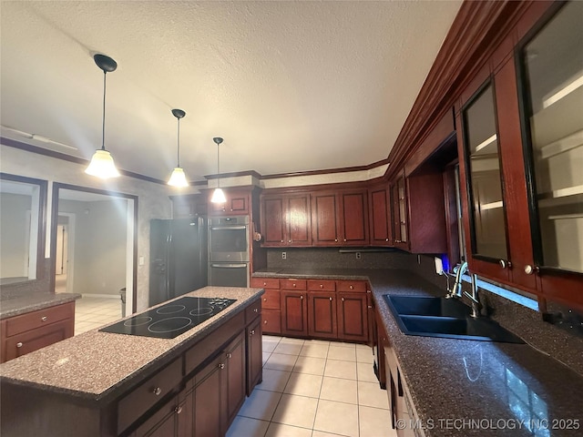 1808 N Woodland, Drumright, OK 74030 - kitchen featuring black electric stovetop, a sink, light tile patterned flooring, stainless steel double oven, and a kitchen island