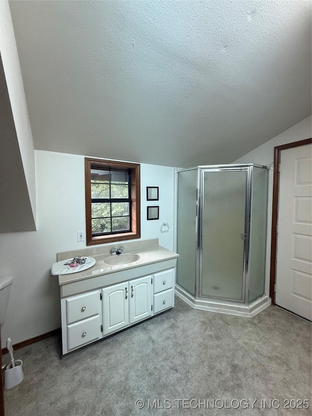 1808 N Woodland, Drumright, OK 74030 - full bath with a textured ceiling, a stall shower, vanity, vaulted ceiling, and carpet floors
