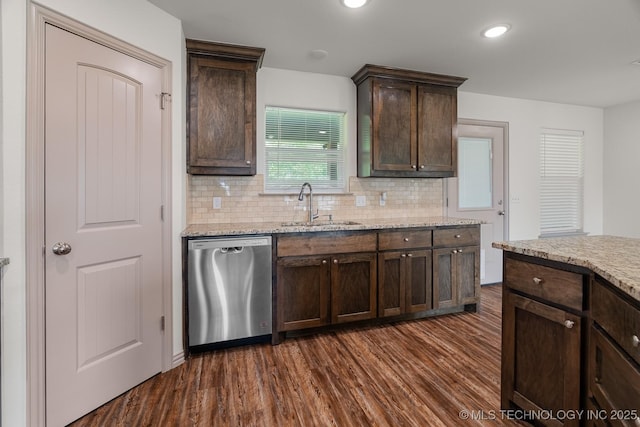 3923 Bryan Rd, Durant, OK 74701 - kitchen with dishwasher, a sink, dark brown cabinetry, dark wood-style floors, and backsplash