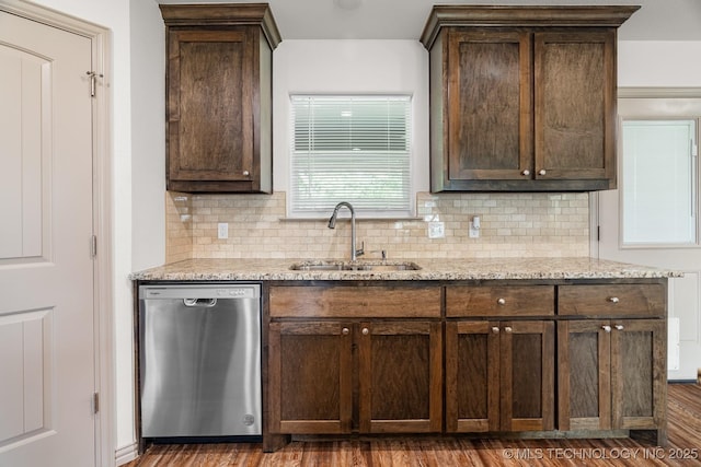 3923 Bryan Rd, Durant, OK 74701 - kitchen featuring dishwasher, a sink, dark brown cabinets, and backsplash