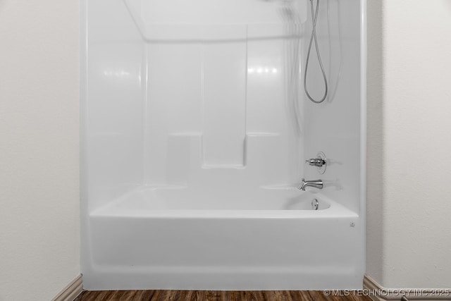 3923 Bryan Rd, Durant, OK 74701 - bathroom featuring shower / bathtub combination and wood finished floors