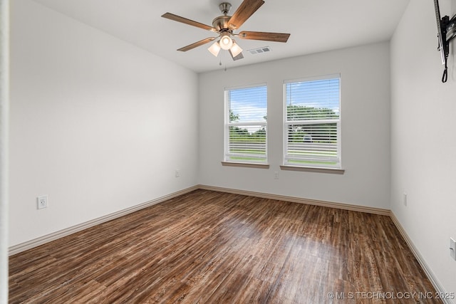 3923 Bryan Rd, Durant, OK 74701 - empty room featuring wood finished floors, a ceiling fan, and baseboards