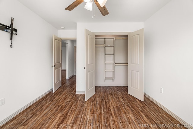3923 Bryan Rd, Durant, OK 74701 - unfurnished bedroom featuring wood finished floors, a closet, baseboards, and ceiling fan