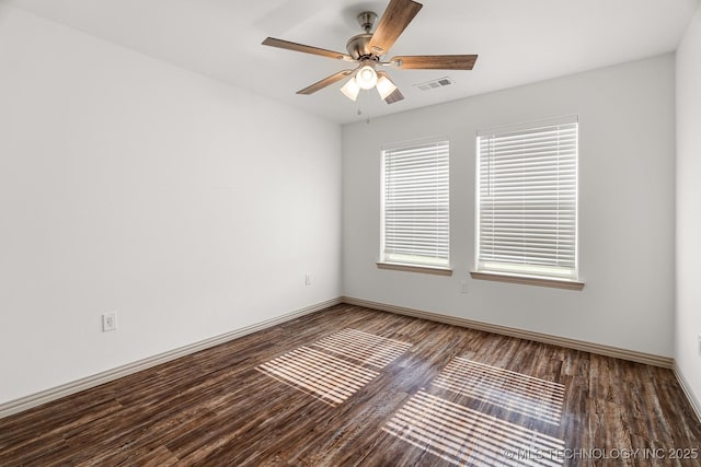 3923 Bryan Rd, Durant, OK 74701 - empty room with wood finished floors, ceiling fan, and baseboards
