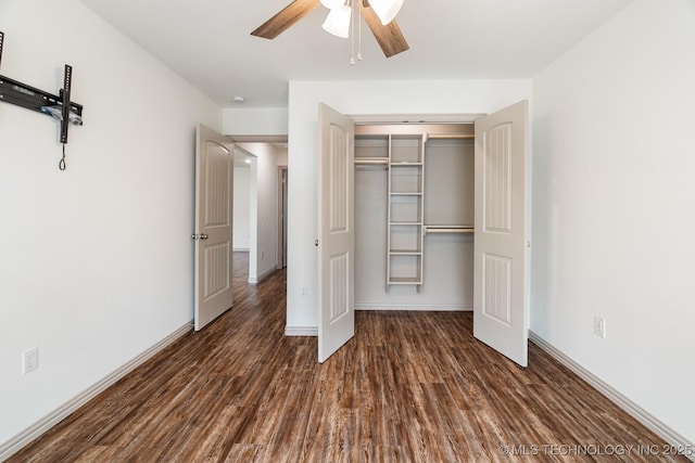 3923 Bryan Rd, Durant, OK 74701 - unfurnished bedroom featuring wood finished floors, a closet, baseboards, and a ceiling fan