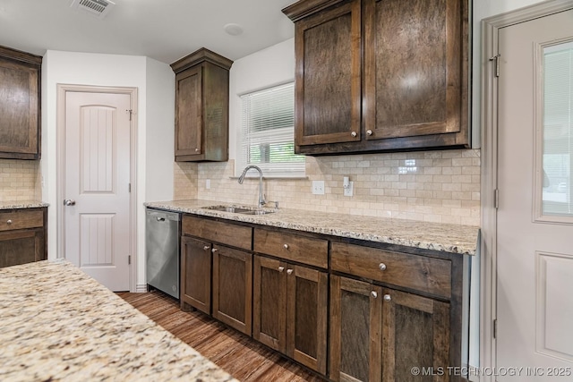 3923 Bryan Rd, Durant, OK 74701 - kitchen with dishwasher, a sink, dark brown cabinetry, tasteful backsplash, and dark wood-style floors