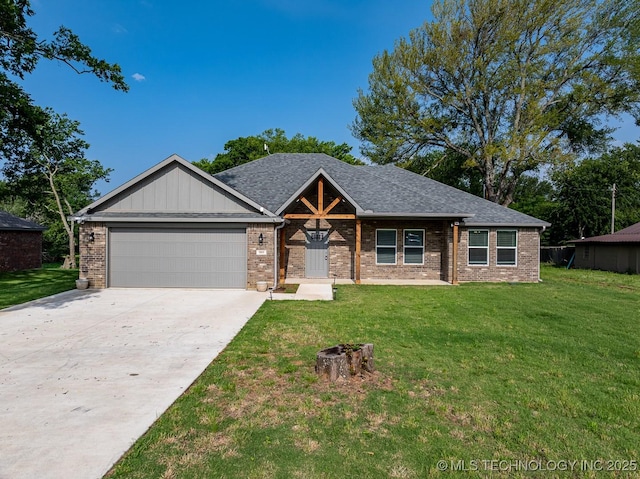3923 Bryan Rd, Durant, OK 74701 - view of front of home featuring a garage, a front lawn, concrete driveway, and brick siding