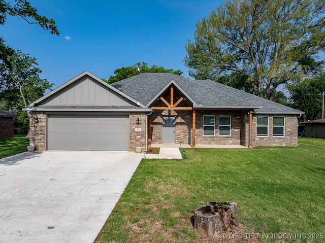 3923 Bryan Rd, Durant, OK 74701 - view of front of house featuring an attached garage, a front yard, driveway, and brick siding