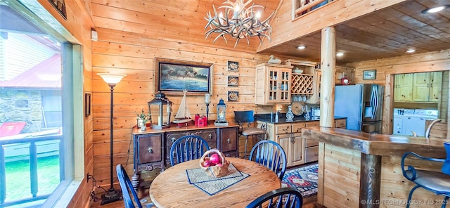 116433 S 4210th Rd, Eufaula, OK 74432 - dining area with washing machine and clothes dryer, wooden walls, healthy amount of natural light, a chandelier, and wooden ceiling