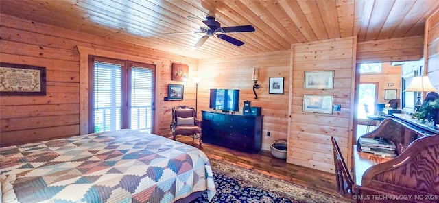 116433 S 4210th Rd, Eufaula, OK 74432 - bedroom with wood walls, wooden ceiling, multiple windows, and wood finished floors