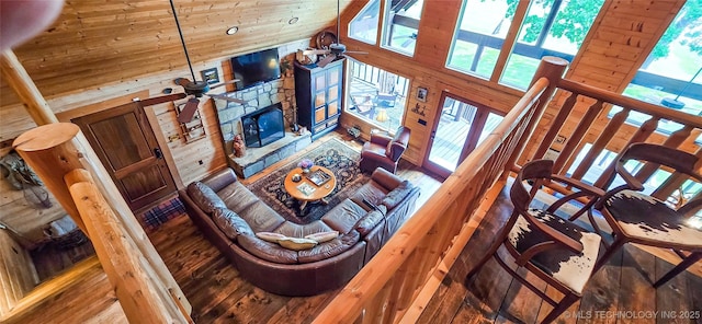 116433 S 4210th Rd, Eufaula, OK 74432 - living room with a ceiling fan, wood walls, wood finished floors, a fireplace, and high vaulted ceiling