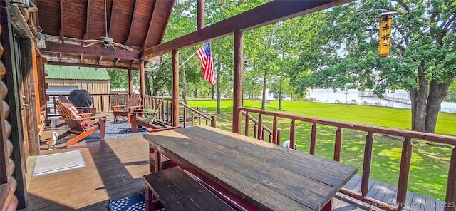 116433 S 4210th Rd, Eufaula, OK 74432 - wooden deck with ceiling fan, outdoor dining space, and a lawn