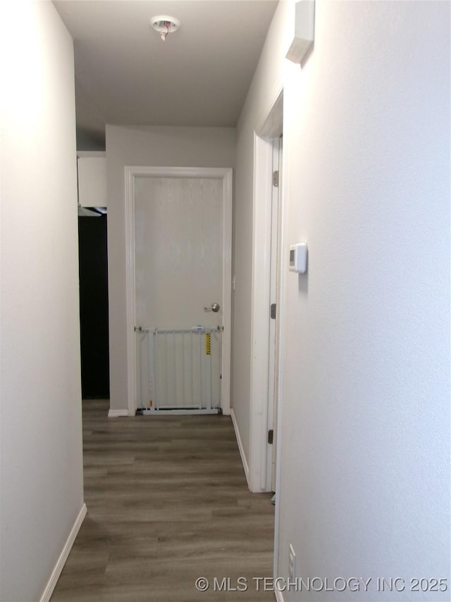 7882 E 132nd Pl S, Bixby, OK 74008 - corridor with wood finished floors, baseboards, and radiator heating unit