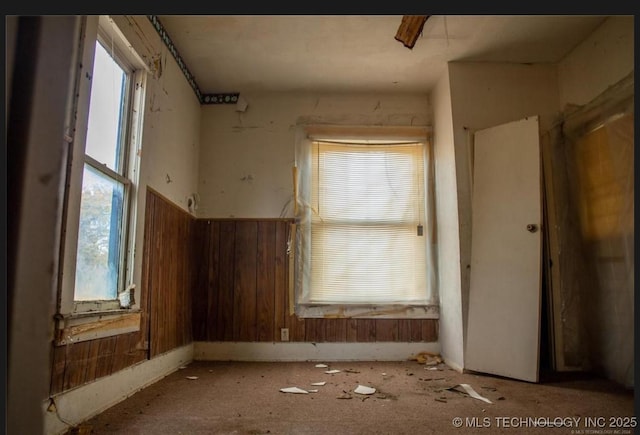 425 W Southside Blvd, Muskogee, OK 74401 - spare room featuring plenty of natural light and wooden walls